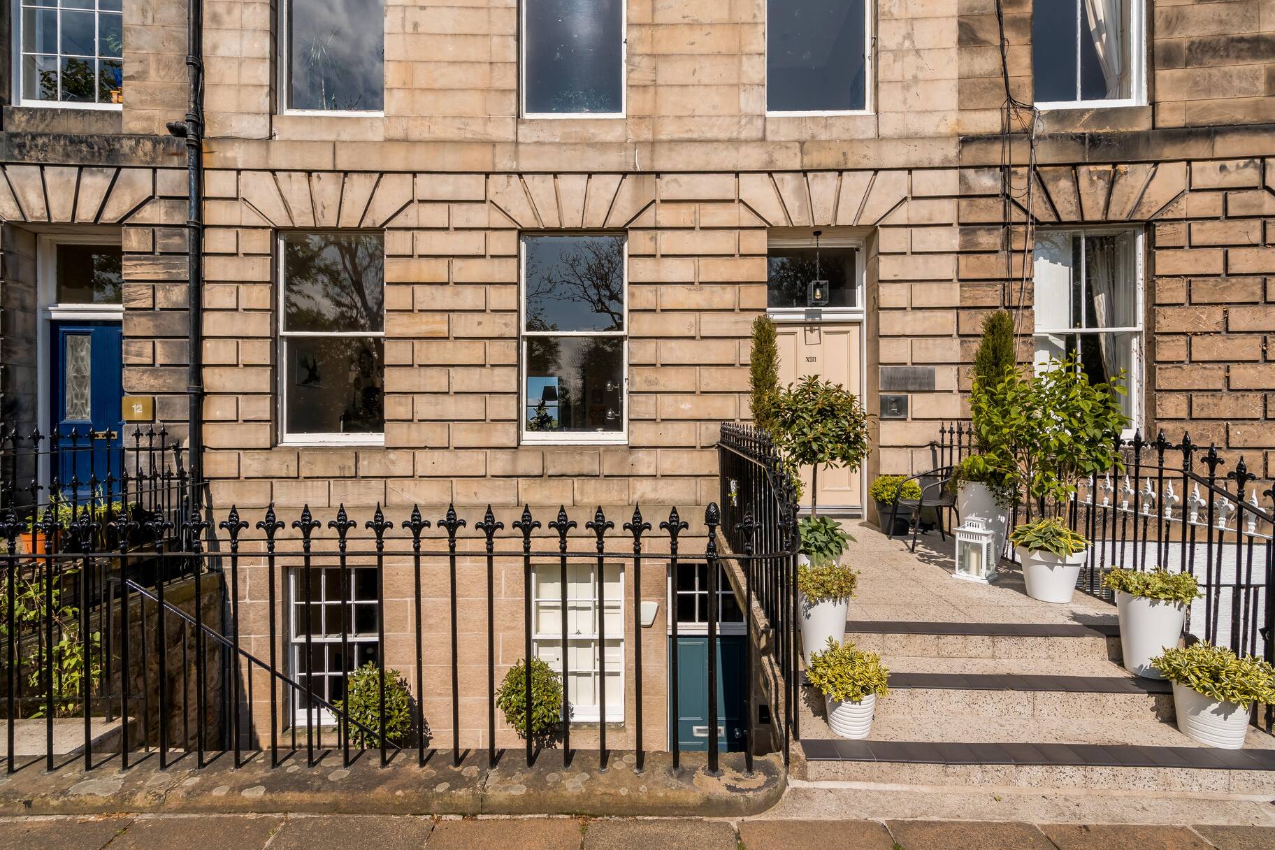 Our sunny entrance and terrace where you can take a coffee